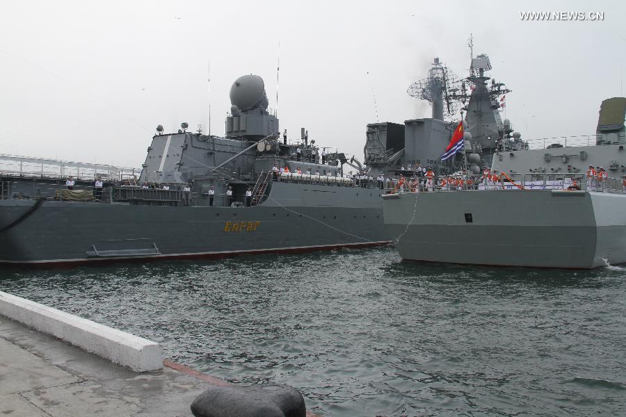 Destroyer Shenyang (R) of the Chinese People's Liberation Army (PLA) Navy is anchored in Vladivostok, Russia, July 5, 2013. Chinese fleet consisting of seven naval vessels arrived in Vladivostok on Friday to participate in Sino-Russian joint naval drills scheduled for July 5 to 12 at the sea area and airspace of the Peter the Great Gulf in the Sea of Japan. (Xinhua/Wang Jingguo)