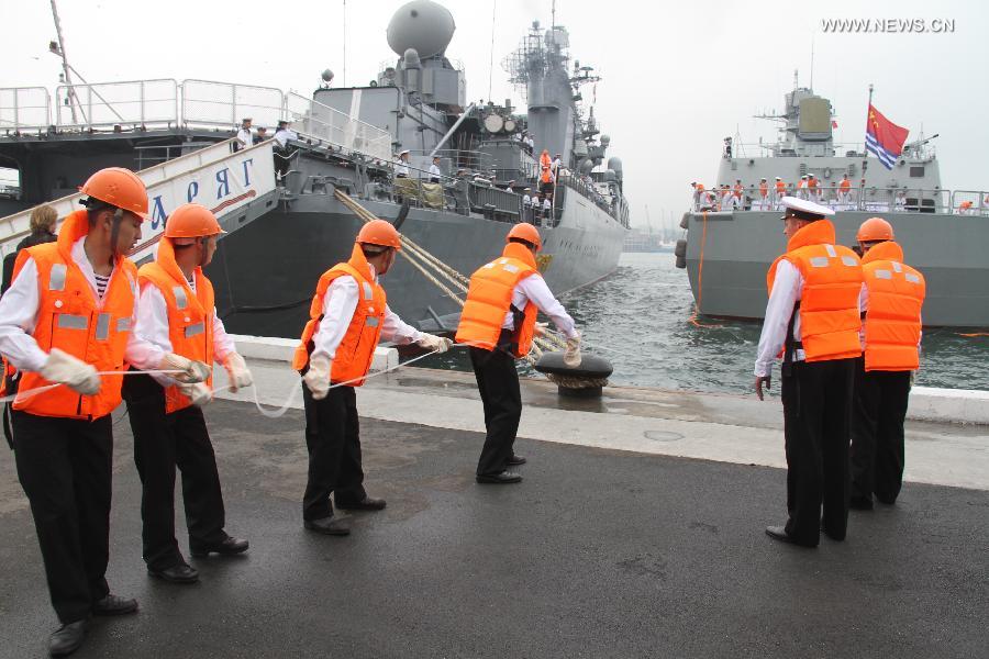 Destroyer Shenyang (R) of the Chinese People's Liberation Army (PLA) Navy is anchored in Vladivostok, Russia, July 5, 2013. Chinese fleet consisting of seven naval vessels arrived in Vladivostok on Friday to participate in Sino-Russian joint naval drills scheduled for July 5 to 12 at the sea area and airspace of the Peter the Great Gulf in the Sea of Japan. (Xinhua/Wang Jingguo)