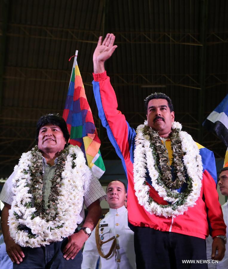 Image provided by Venezuela's Presidency shows President of Venezuela Nicolas Maduro (R) and Bolivia's President Evo Morales (L) participating in the meeting of the Union of South American Nations (UNASUR, by its acronym in Spanish) in Cochabamba, Bolivia, on July 4, 2013. (Xinhua/Venezuela's Presidency)