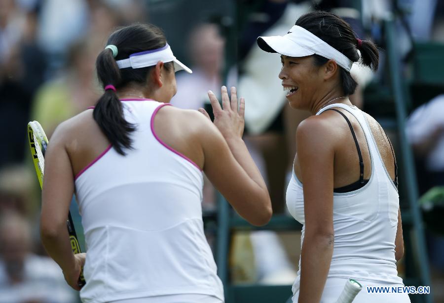 Peng Shuai(L) of China and Su-Wei Hsieh of Chinese Taipei celebrate during the final of women's doubles on day 12 of the Wimbledon Lawn Tennis Championships at the All England Lawn Tennis and Croquet Club in London, Britain on July 6, 2013. Peng Shuai and Su-Wei Hsieh claimed the title by defeating Australia's Ashleigh Barty and Casey Dellacqua with 7-6(1) 6-1.(Xinhua/Wang Lili) 