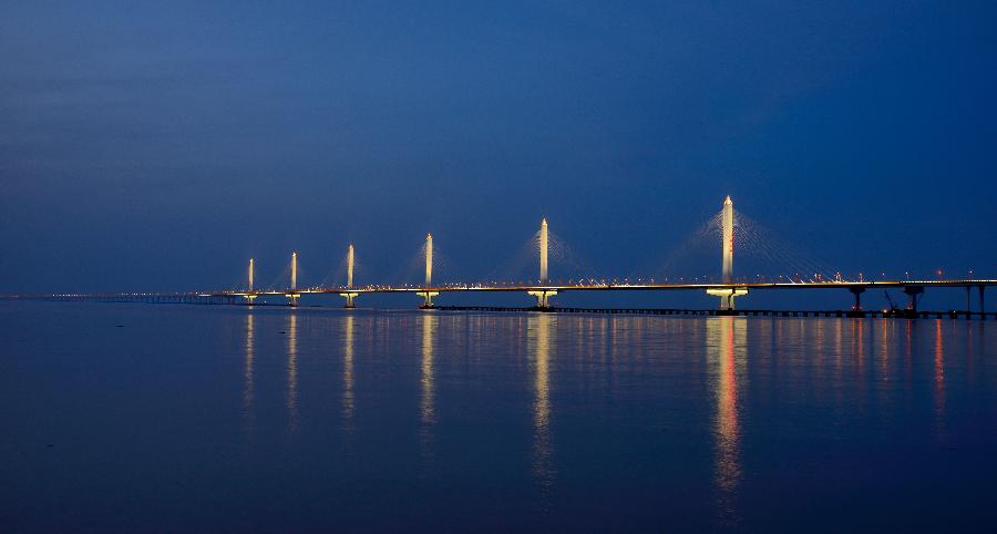 Photo taken on July 1, 2013 shows the Jiaxing-Shaoxing Sea Bridge in Shaoxing, east China's Zhejiang Province, June 17, 2013. The linking roads of the bridge was completed on July 6. The bridge is expected to be open to traffic in mid-July. With a span of 10 kilometers over the Hangzhou Bay, it is the world's longest and widest multi-pylon cable-stayed bridge. (Xinhua/Yuan Yun)