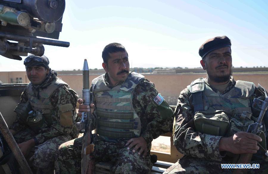 Afghan army soldiers are seen in their military vehicles during an operation against Taliban in Jauzjan in northern of Afghanistan on July 7, 2013. Afghan security forces backed by the NATO-led International Security Assistance Force (ISAF) raided a Taliban hideout in Jauzjan province 390 km north of Kabul early Sunday, killing 18 militants and injuring a dozen others, deputy to provincial governor Abdul Rahman Mahmoudi said. (Xinhua/Arui)