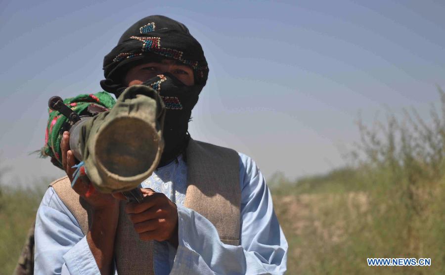 An Afghan army soldier is seen holding a heavy weapon during an operation against Taliban in Jauzjan in northern of Afghanistan on July 7, 2013. Afghan security forces backed by the NATO-led International Security Assistance Force (ISAF) raided a Taliban hideout in Jauzjan province 390 km north of Kabul early Sunday, killing 18 militants and injuring a dozen others, deputy to provincial governor Abdul Rahman Mahmoudi said. (Xinhua/Arui)