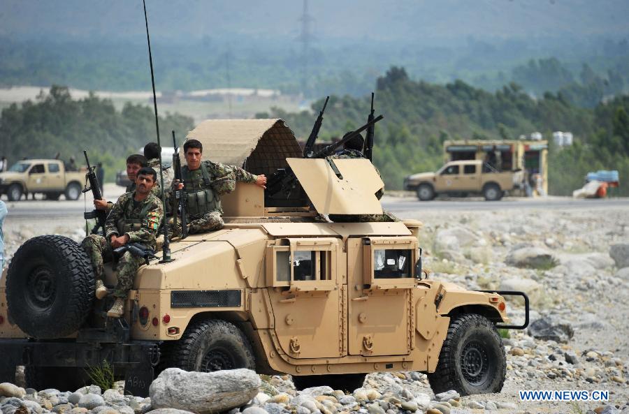 Afghan army soldiers patrol with their military vehicles during an operation against Taliban in Laghman province in eastern of Afghanistan on July 7, 2013. At least five Taliban fighters killed by Afghan army soldiers during an operation in Laghman province on Sunday Army officials said. (Xinhua/Tahir Safi)