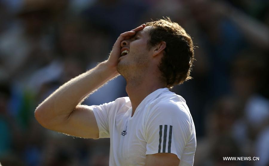 Andy Murray of Britain celebrates after winning the men's singles final match with Novak Djokovic of Serbia on day 13 of the Wimbledon Lawn Tennis Championships at the All England Lawn Tennis and Croquet Club in London, Britain, July 7, 2013. Andy Murray won his first Wimbledon title and ended Britain's 77-year wait for a men's champion with a 6-4 7-5 6-4 victory over world number one Novak Djokovic. (Xinhua/Wang Lili)