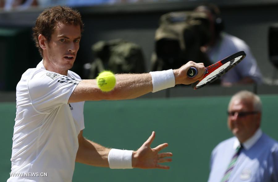Andy Murray of Great Britain competes during the final of gentlemen's singles against Novak Djokovic of Serbia on day 13 of the Wimbledon Lawn Tennis Championships at the All England Lawn Tennis and Croquet Club in London, Britain, on July 7, 2013. (Xinhua/Wang Lili)