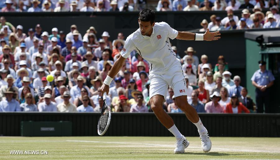 Novak Djokovic of Serbia competes during the final of gentlemen's singles against Andy Murray of Great Britain on day 13 of the Wimbledon Lawn Tennis Championships at the All England Lawn Tennis and Croquet Club in London, Britain, on July 7, 2013. (Xinhua/Wang Lili)