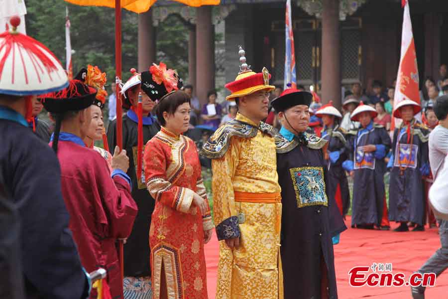 Aisin Gioro Hengshao, an offspring of the imperial family of Qing Dynasty (1644-1911), attends a ceremony in the costume of a Qing emperor to worship his ancestors at the World Heritage Yongling Tomb in Fushun, Liaoning Province, July 7, 2013. The ceremony was held to encourage the locals to protect the tomb and the fellow members of the Manchu minority group to treasure both the physical and spiritual cultural inheritance passed on from ancient times. (CNS/Cao Lichun)