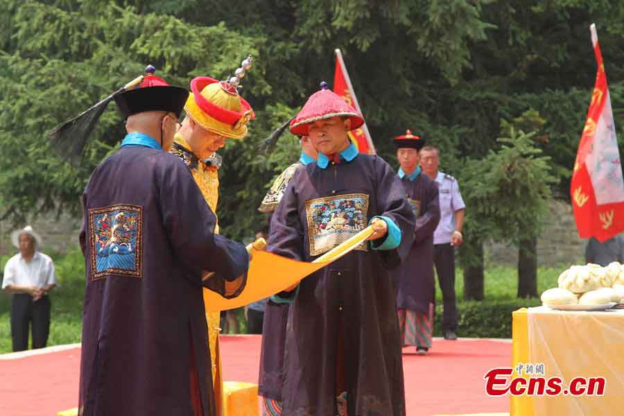 Aisin Gioro Hengshao, an offspring of the imperial family of Qing Dynasty (1644-1911), attends a ceremony in the costume of a Qing emperor to worship his ancestors at the World Heritage Yongling Tomb in Fushun, Liaoning Province, July 7, 2013. The ceremony was held to encourage the locals to protect the tomb and the fellow members of the Manchu minority group to treasure both the physical and spiritual cultural inheritance passed on from ancient times. (CNS/Cao Lichun)