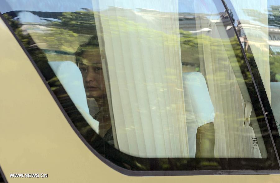 The relative of an air crash victim sits on a bus from east China's Jiangshan to Shanghai to catch a plane for the United States, in Jiangshan City, east China's Zhejiang Province, July 8, 2013. Two Chinese passengers Wang Linjia and Ye Mengyuan were killed in a crash landing of an Asiana Airlines Boeing 777 at San Francisco airport on Saturday morning. Their family members headed for the United States on Monday. (Xinhua/Han Chuanhao)