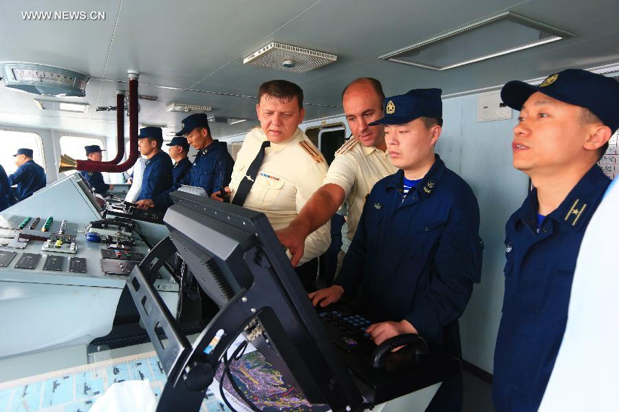 Liaison officers of China and Russia are seen during joint naval drills near Vladivostok, Russia, July 8, 2013. China and Russia started on Monday the joint naval drills off the coast of Russia's Far East. (Xinhua/Zha Chunming)