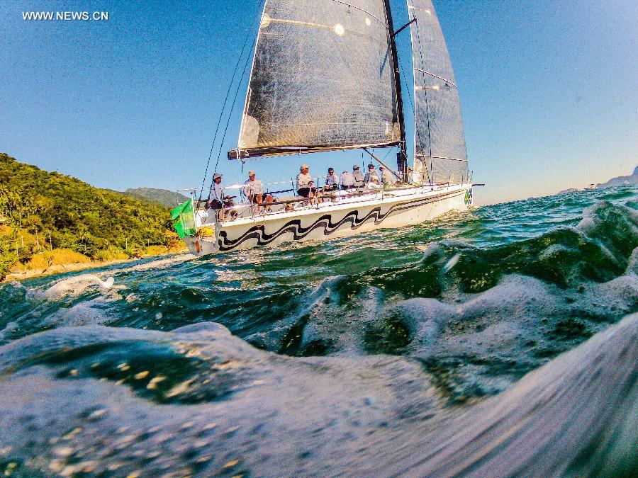 Competitors compete in the Rolex Ilhabela Sailing Week 2013, held in the Ilhabela Yacht Club, in Ilhabela, Brazil, on July 7, 2013. The Ilhabela Sailing Week is the greatest oceanic boat race in Latin America, with more than 150 inscribed boats and teams from more than 8 countries. Brazilian Olympic medalist and world champion of the Round the World race, Torben Grael, leads the competition until now. (Xinhua/Marcos Mendez)