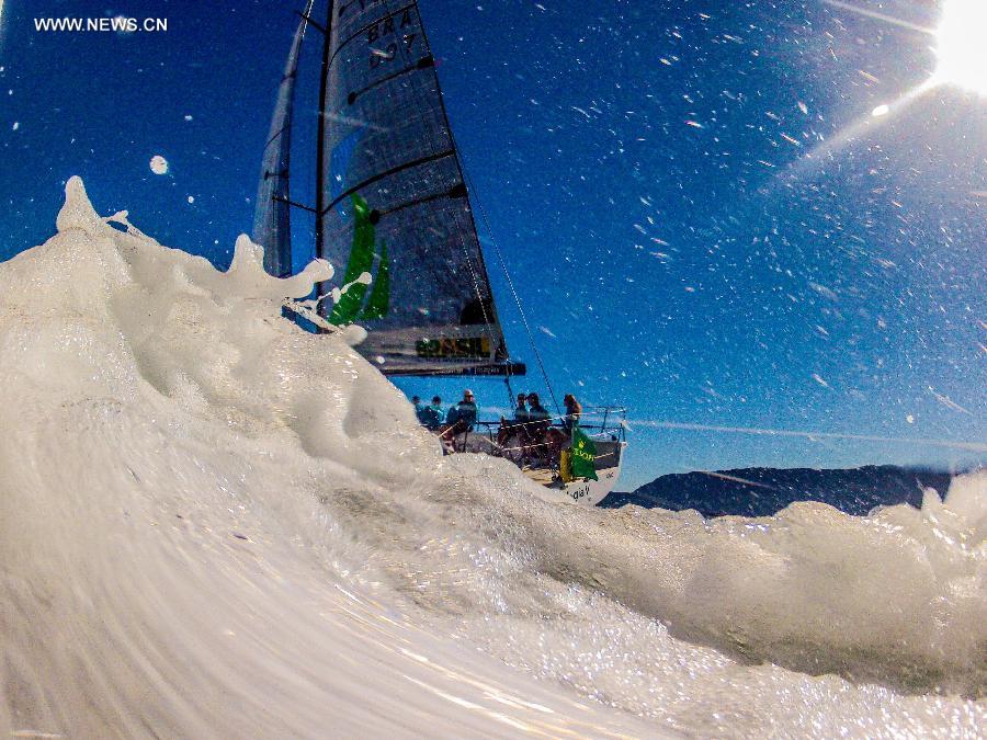 Competitors compete in the Rolex Ilhabela Sailing Week 2013, held in the Ilhabela Yacht Club, in Ilhabela, Brazil, on July 7, 2013. The Ilhabela Sailing Week is the greatest oceanic boat race in Latin America, with more than 150 inscribed boats and teams from more than 8 countries. Brazilian Olympic medalist and world champion of the Round the World race, Torben Grael, leads the competition until now. (Xinhua/Marcos Mendez)