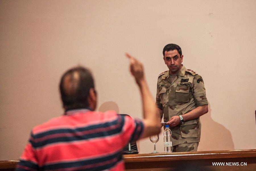 Egyptian armed forces spokesman Col. Ahmed Mohamed Ali is seen during a press conference in Cairo, Egypt, Monday, July 8, 2013. The Egyptian security forces opened fire at supporters of ousted President Mohamed Morsi in Cairo, with at least 51 people killed, while Ahmed Mohamed Ali said that armed men attacked troops in the area around the Republican Guard compound in the northeast of the city.(Xinhua/Amru Salahuddien)