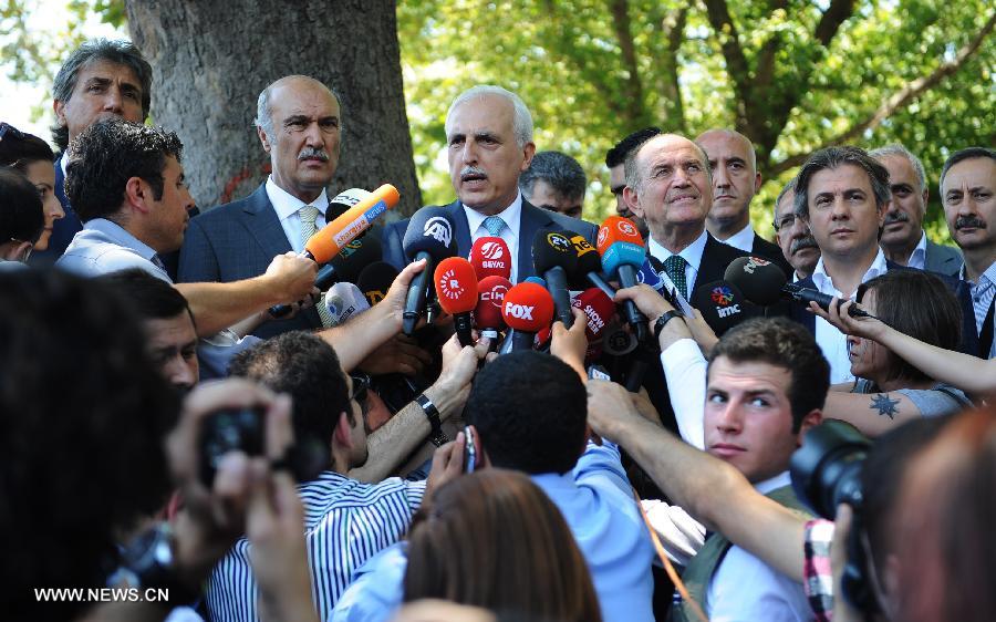 The governor of Istanbul, Huseyin Avni Mutlu (C) announces the reopening of the Gezi park in Istanbul on July 8, 2013. Turkey's Gezi Park was opened to the public Monday after a week-long closure, Istanbul Governor Huseyin Avni Mutlu announced. (Xinhua/Lu Zhe)