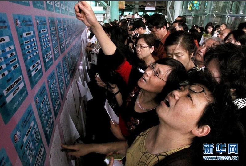 Regularly in parks across the city, for example Shanghai People's Park, parents gather in their thousands to find dates for their children. They display their homemade laminated signs with the important information of their children, like income and education, and search for a suitable match. 