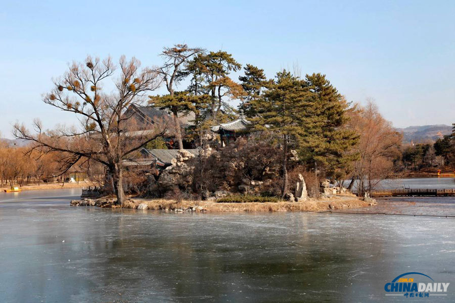 The Photo shows a reprentative buliding complex that has been fully restored from the original. The structure, built by Emperor Qianlong, is located on Qinglian Island. Lotuses in the lake compete to blossom in summer and autumn, with a thin layer of fog above providing some amazing scenery. (Photo by Jia Yue for Chinadaily.com.cn)