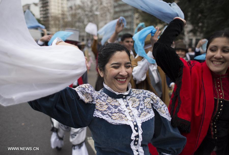 Women dressed with traditional costumes participate in a parade during the celebration of Independence Day, in Buenos Aires, Argentina, on July 9, 2013. (Xinhua/Martin Zabala)