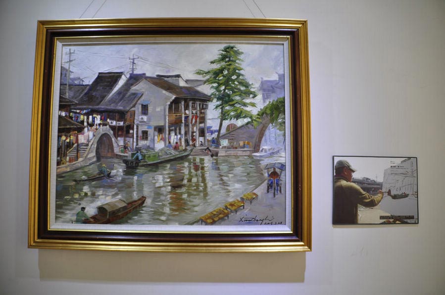 "A Glimpse of Rongguang Bridge, Keqiao Ancient Town, Shaoxing City" (80cmX100cm), March 28, 2013. Chinese Australian oil painter Li Xiaozheng's new exhibition themed "Jiangnan Charm" opened on July 7 at the Roundness Art Gallery in Beijing's Songzhuang, the largest art zone in both China and the world. The exhibition features 28 artworks created by Li during his 34-day fieldtrip, between March and April of this year, to Jiangnan. (China.org.cn/Zhang Junmian)