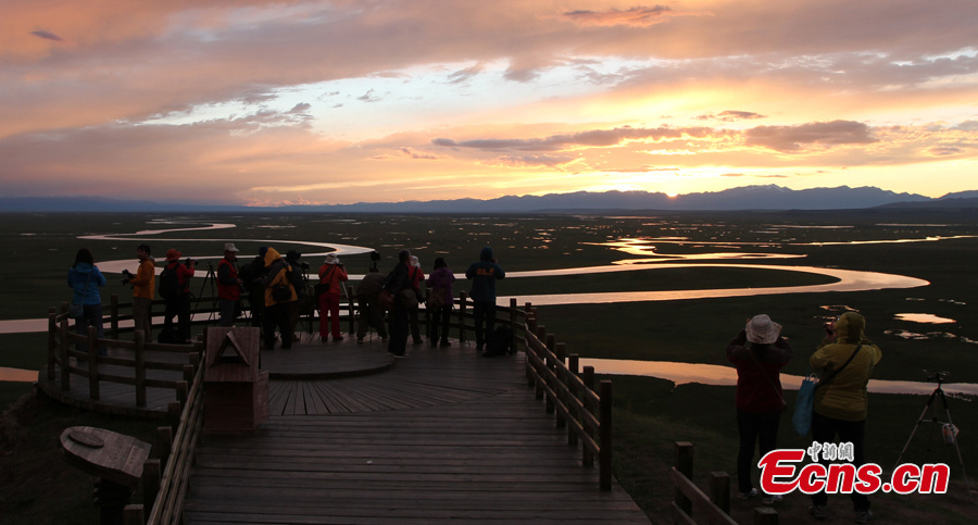 The sky turns red at sunset over the Bayanbulak Grassland in Hejing County, Northwest China's Xinjiang Uygur Autonomous Region. The Bayanbulak Grassland is a great prairie boasting luxuriant verdant grass, numerous flocks of sheep and varied plants, making it the second largest grassland in China. (CNS)