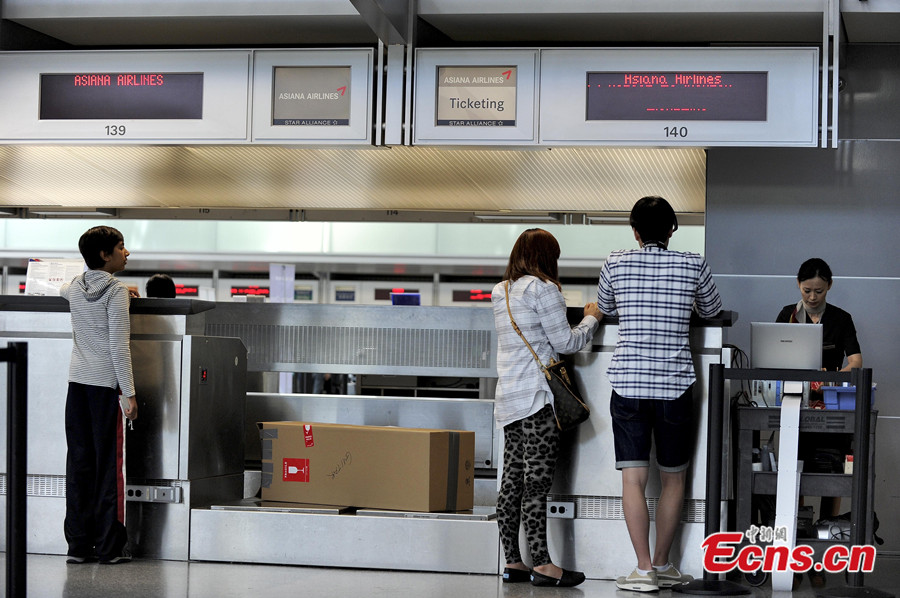 Asiana Airlines' flights to Beijing at San Francisco International Airport are back to normal on July 8, 2013, after the airport re-opens some international airlines. Due to a deadly crash on July 6, the airport was completely closed for all approaching and departing flights. Two Chinese schoolgirls were killed and 182 passengers injured in the crash. (Photo: crienglish/CNS)