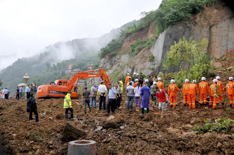 Rescuers work at the mudflow site in Pingwu County of Mianyang City, southwest China's Sichuan Province, July 10, 2013. A section of the Jiuzhaigou ring highway was hit by a mudflow in Pingwu on Wednesday noon. No casualties have been reported yet. Rescue work is under way. (Xinhua/Hu Yu)