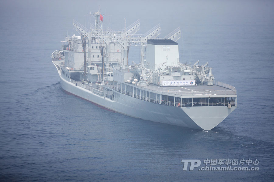 Chinese and Russian warships participating in the China-Russia "Joint Sea-2013" joint naval drill conduct joint escort drill in a designated exercise sea area on July 9, 2013. (China Military Online/Sun Yang) 