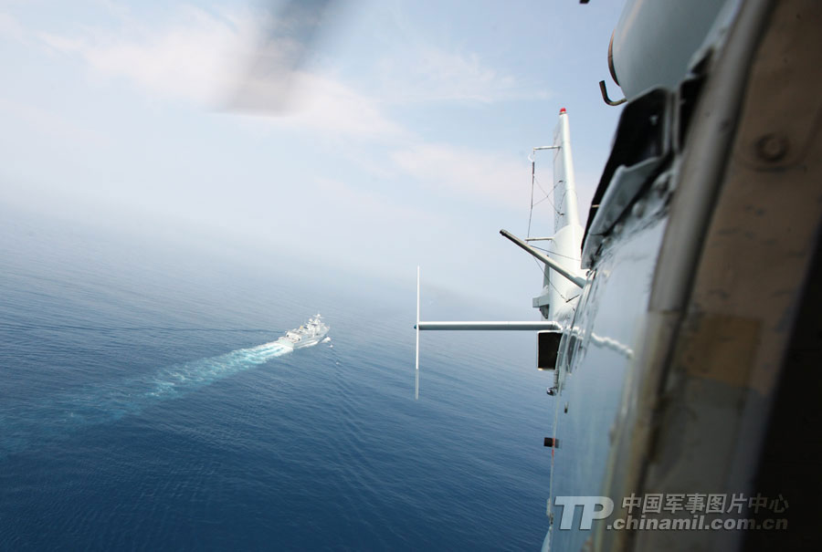 Chinese and Russian warships participating in the China-Russia "Joint Sea-2013" joint naval drill conduct joint escort drill in a designated exercise sea area on July 9, 2013. (China Military Online/Sun Yang) 