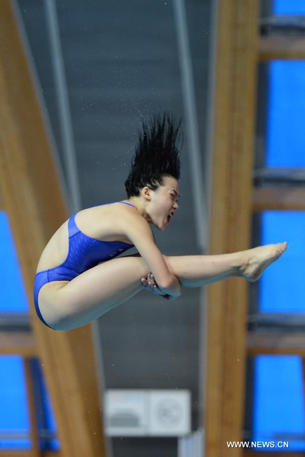 Zheng Shuangxue of China competes during the final of women's 3m Spingboard diving at the 27th Summer Universiade in Kazan, Russia, July 10, 2013. Zheng Shuangxue won the gold medal with 329.25. (Xinhua/Kong Hui)