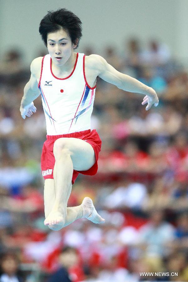 Ryohei Kato of Japan competes during the men's floor exercise final at the 27th Summer Universiade in Kazan, Russia, July 10, 2013. Ryohei Kato won the gold medal with 15.450 points. (Xinhua/Ren Yuan)