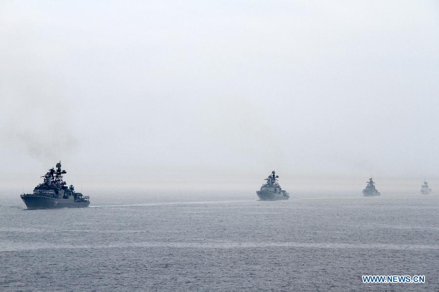 Naval vessels are seen during a military review of the "Joint Sea-2013" drill at Peter the Great Bay in Russia, July 10, 2013. The "Joint Sea-2013" drill participated by Chinese and Russian warships concluded here on Wednesday. (Xinhua/Wang Jingguo)