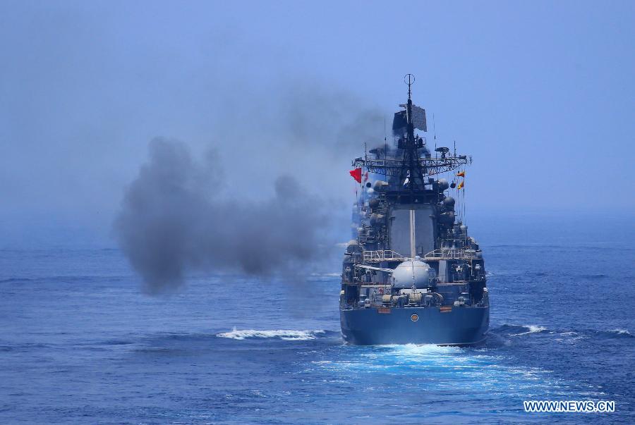Russian naval vessel fires to a target during the "Joint Sea-2013" drill at Peter the Great Bay in Russia, July 10, 2013. The "Joint Sea-2013" drill participated by Chinese and Russian warships concluded here on Wednesday. (Xinhua/Zha Chunming)