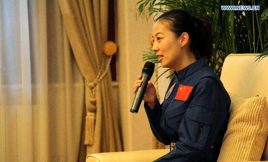 Wang Yaping, astronaut of China's Shenzhou-10 mission, answers questions at a press conference in Beijing, China, July 11, 2013. Nie Haisheng, Zhang Xiaoguang and Wang Yaping, the three astronauts of China's Shenzhou-10 mission, have completed their medical quarantine and are in good conditions, according to official sources. (Xinhua/Liu Fang) 