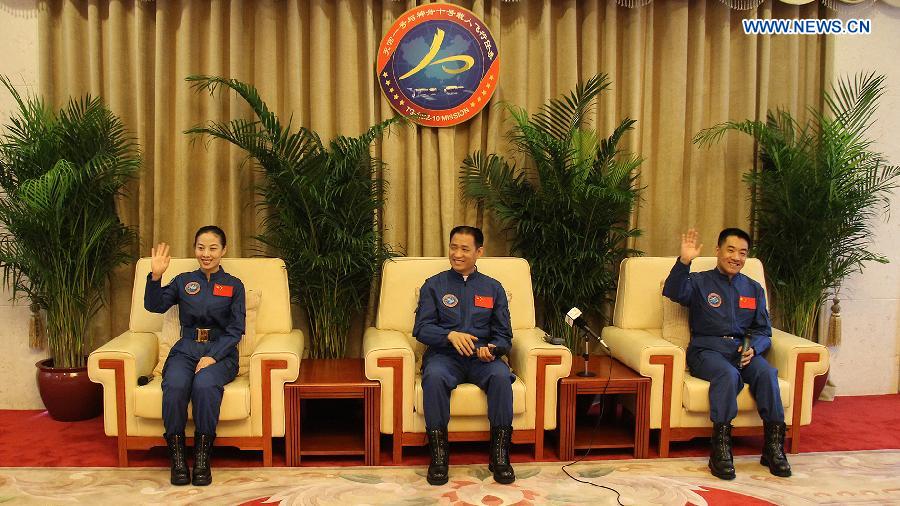 Astronauts of China's Shenzhou-10 mission Nie Haisheng (C), Zhang Xiaoguang (R) and Wang Yaping are present at a press conference in Beijing, China, July 11, 2013. The three astronauts have completed their medical quarantine and are in good conditions, according to official sources. (Xinhua/Liu Fang) 