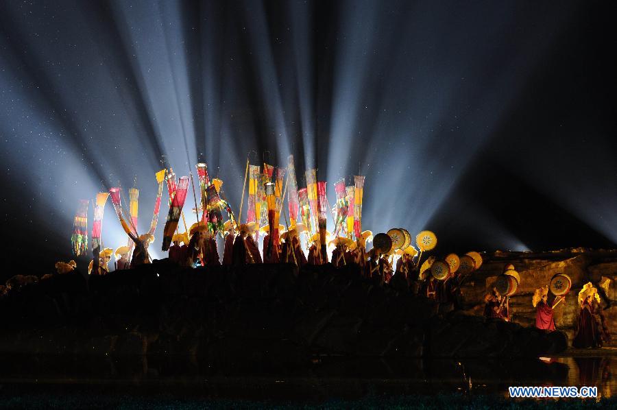 Kangxi ceremony is performed in Chengde, north China's Hebei Province, July 11, 2013. The show depicts the stories of Kangxi (1654-1722), the fourth emperor of ancient China's Qing Dynasty (1644-1911). During the reign of Kangxi, China witnessed a strong and prosperous period. Kangxi ceremony has run for 218 performances and has drwan nearly 200,000 viewers since its premiere in June 2011. (Xinhua/Wang Min)