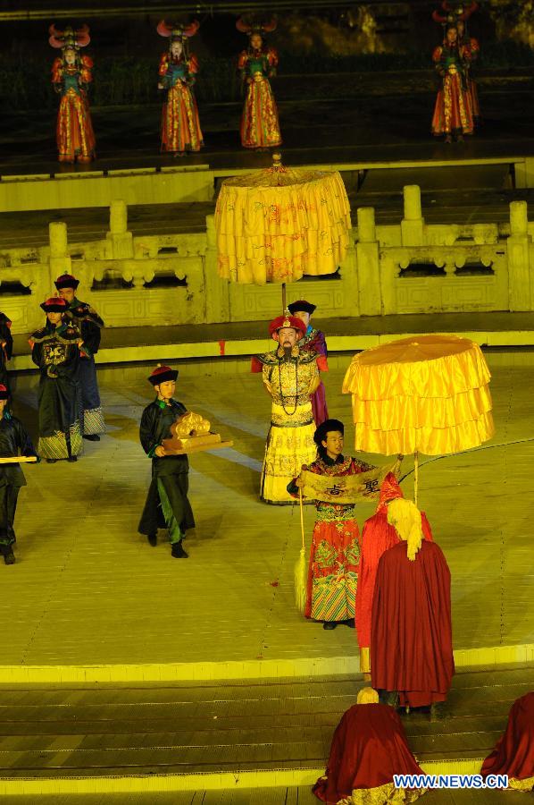 Kangxi ceremony is performed in Chengde, north China's Hebei Province, July 11, 2013. The show depicts the stories of Kangxi (1654-1722), the fourth emperor of ancient China's Qing Dynasty (1644-1911). During the reign of Kangxi, China witnessed a strong and prosperous period. Kangxi ceremony has run for 218 performances and has drwan nearly 200,000 viewers since its premiere in June 2011. (Xinhua/Wang Min)