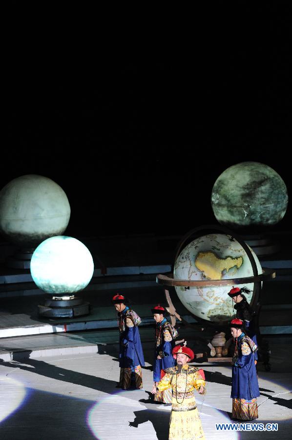 Kangxi ceremony is performed in Chengde, north China's Hebei Province, July 11, 2013. The show depicts the stories of Kangxi (1654-1722), the fourth emperor of ancient China's Qing Dynasty (1644-1911). During the reign of Kangxi, China witnessed a strong and prosperous period. Kangxi ceremony has run for 218 performances and has drwan nearly 200,000 viewers since its premiere in June 2011. (Xinhua/Wang Min)