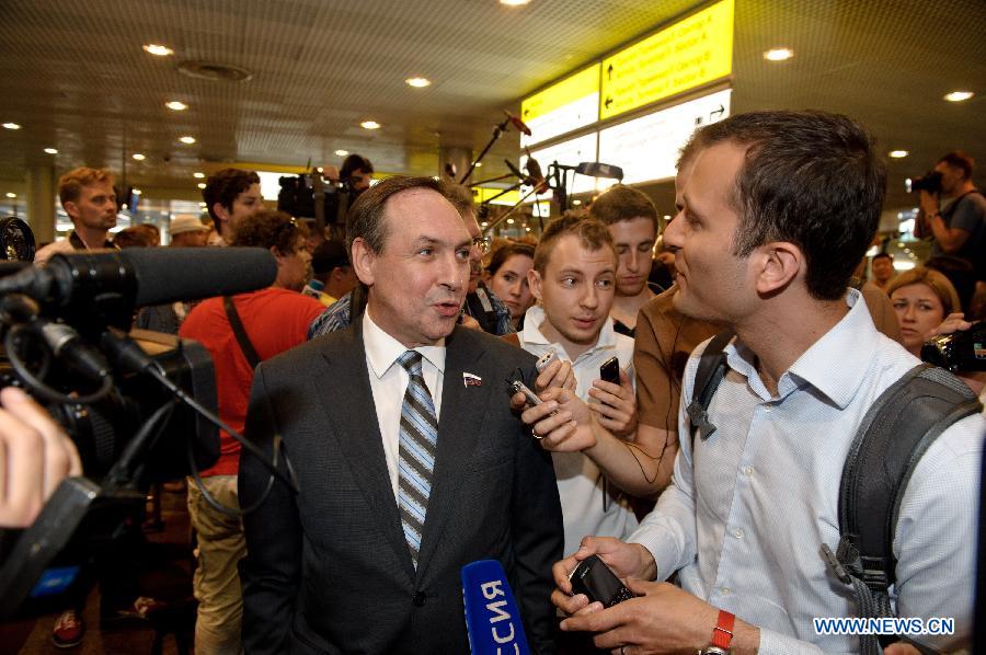 A representative of a Russian human rights organization receives interviews in Terminal F at Moscow's Sheremetyevo International Airport, Russia, on July 12, 2013. Former U.S. spy agency contractor Edward Snowden planned to meet with Russian activists, lawyers as well as representatives from other organizations on Friday, Moscow's Sheremetyevo airport authority confirmed. (Xinhua/Jiang Kehong)