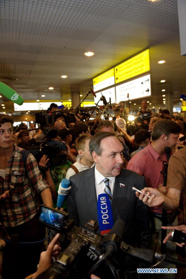 A representative of a Russian human rights organization receives interviews in Terminal F at Moscow's Sheremetyevo International Airport, Russia, on July 12, 2013. Former U.S. spy agency contractor Edward Snowden planned to meet with Russian activists, lawyers as well as representatives from other organizations on Friday, Moscow's Sheremetyevo airport authority confirmed. (Xinhua/Jiang Kehong) 