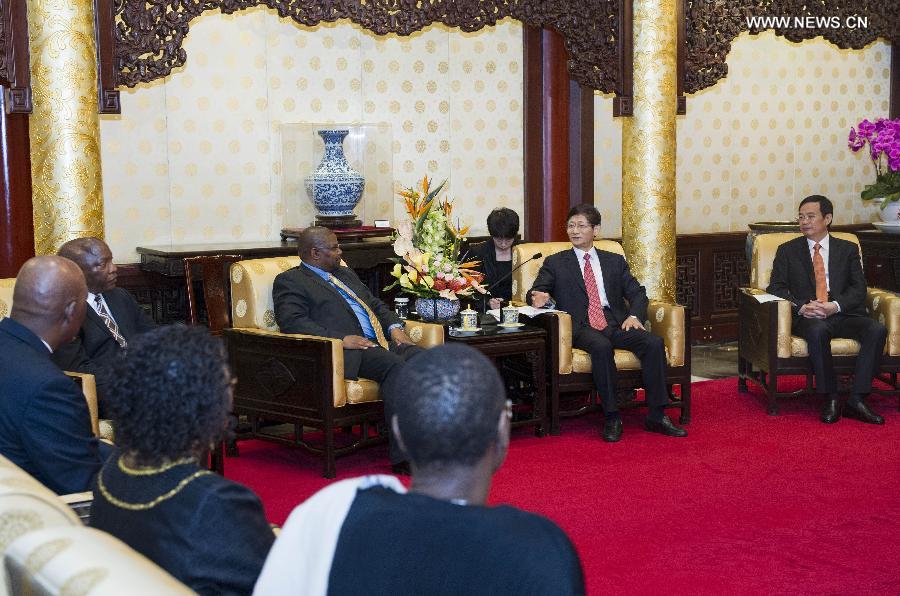 Meng Jianzhu (2nd R), a member of the Political Bureau of the Communist Party of China (CPC) Central Committee and also secretary of the Commission for Political and Legal Affairs of the CPC Central Committee, meets with a delegation of senior cadres of the African National Congress (ANC) of South Africa, headed by Obed Bapela, deputy minister in the presidency and chairman of the international relations subcommittee of the ANC, in Beijing, capital of China, July 12, 2013. (Xinhua/Wang Ye)