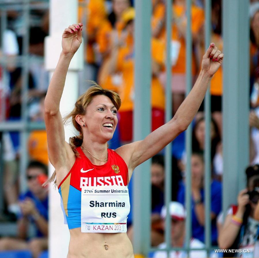 Ekaterina Sharmina of Russia celebrates after the women's 1500m final at the 27th Summer Universiade in Kazan, Russia, July 12, 2013. Sharmina won the gold with 4 minutes and 5.49 seconds. (Xinhua/Li Ying)