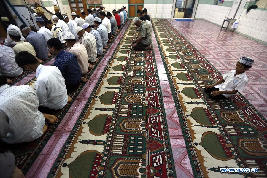 Muslims pray at a mosque during the holy month of Ramadan in Yangon, Myanmar, on July 13, 2013. Muslims throughout the world are celebrating the holy fasting month of Ramadan. (Xinhua/U Aung) 