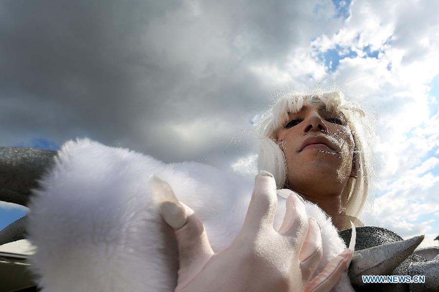 A fan dressed up as a cartoon character attends the 10th "Anime Friends" convention, in Sao Paulo, Brazil, on July 13, 2013. (Xinhua/Rahel Patrasso) 