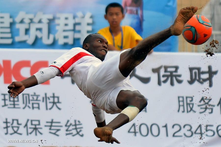 Hasan Ail Saeed Helal Alhammadi of the United Arab Emirates shoots during the match between the United Arab Emirates and Vietnam at the 2013 Asian Beach Soccer Cup held in Haiyang, a coastal city of east China's Shandong province, July 12, 2013. (Xinhua/Zhu Zheng)