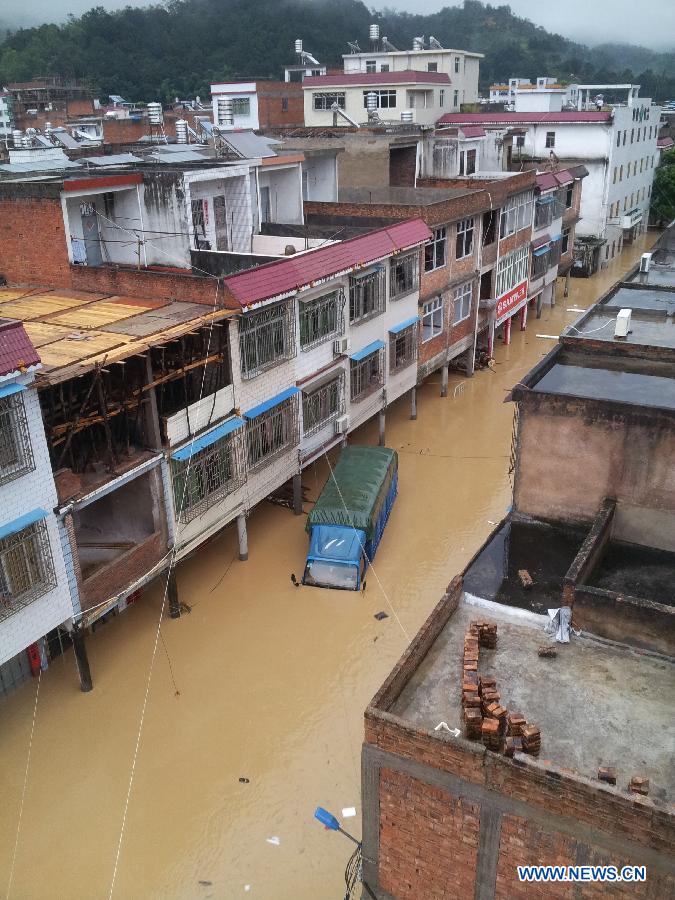 Photo taken on July 14, 2013 shows a waterlogged street in Shatian Township in Meizhou City, south China's Guangdong Province. Typhoon Soulik-triggered rainstorms battered Meizhou from Saturday night, flooding many roads and farmlands. (Xinhua/Zhong Xiaofeng)