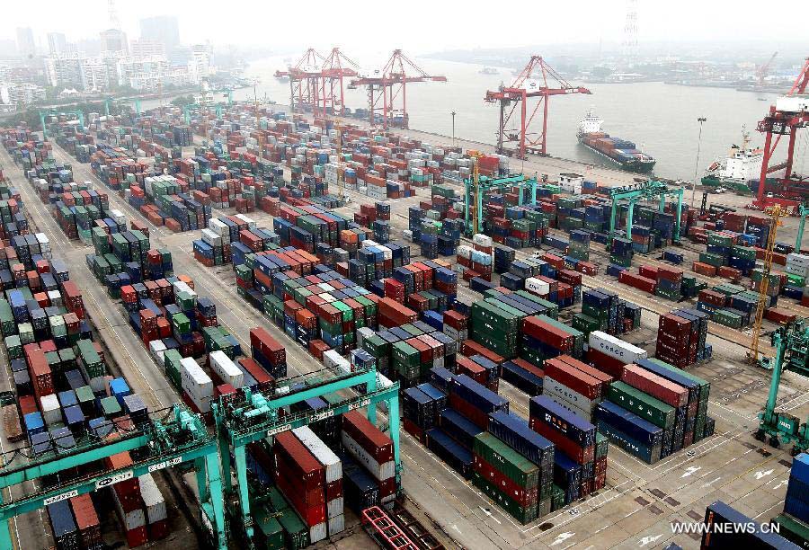 Photo taken on June 16, 2013 shows Zhanghuabang Container Terminal in east China's Shanghai municipality. China's gross domestic product (GDP) totaled 24.8 trillion yuan (4 trillion U.S. dollars) in the first half of 2013, with the growth at 7.6 percent, which is in line with market expectations and was above the government's full-year target of 7.5 percent, data from China's National Bureau of Statistics (NBS) showed on July 15, 2013. (Xinhua/Chen Fei)