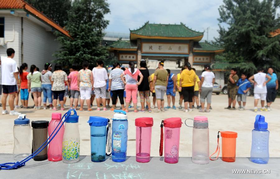 Children take part in outdoor activities at a summer camp against childhood overweight or obesity in Zhengzhou, capital of central China's Henan Province, July 16, 2013. Coached by doctors and counselors from local children's hospital, 37 children participated in the nearly monthlong camp to lose weight. (Xinhua/Li Bo) 