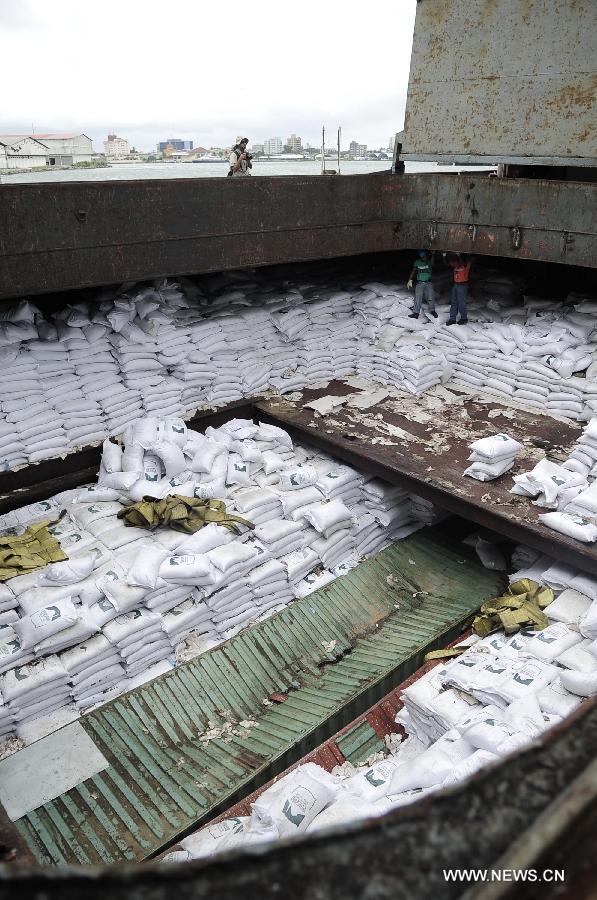 Members of the Panamanian government inspect the cargo on a cargo ship of the Democratic People's Republic of Korea (DPRK) at the Manzanillo Port in Colon City, Panama, on July 16, 2013. The Cuban Foreign Ministry said on Tuesday that a cargo ship of the Democratic People's Republic of Korea (DPRK) seized in Panama was loaded with anti-aircraft missile parts and MiG-21 fighter jets to be returned to the DPRK for repair. (Xinhua/Mauricio Valenzuela) 