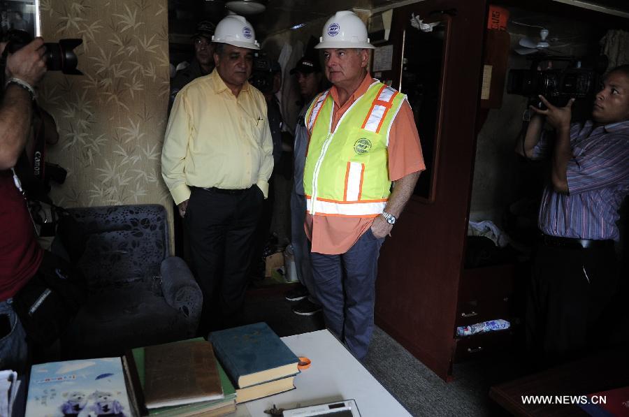 Panama's President Ricardo Martinelli (R) inspects a cargo ship of the Democratic People's Republic of Korea (DPRK) at the Manzanillo Port in Colon City, Panama, on July 16, 2013. The Cuban Foreign Ministry said on Tuesday that a cargo ship of the Democratic People's Republic of Korea (DPRK) seized in Panama was loaded with anti-aircraft missile parts and MiG-21 fighter jets to be returned to the DPRK for repair. (Xinhua/Mauricio Valenzuela) 