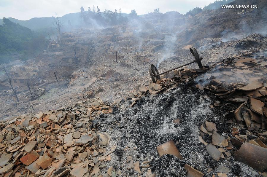 Photo taken on July 16, 2013 shows the accident site in Wusuo Village of Miao ethnic group of Taijiang County, southwest China's Guizhou Province. A fire caused the burnout of more than 200 houses on Monday afternoon with no casualties report. (Xinhua)  